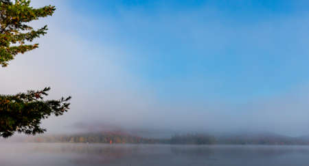 view of a boat dock the Lac-Superieur, misty morning with fog, in Laurentides, Mont-tremblant, Quebec, Canadaの写真素材