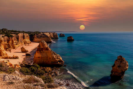 Beach and cliffs of Marinha, in Lagoa, Algarve, Portugalの写真素材