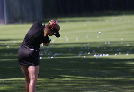 lady golfer in action on a golf course, in Evian, franceのeditorial素材