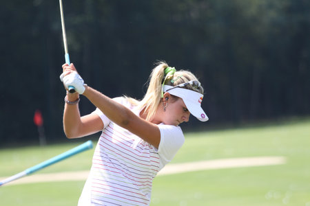 lady golfer in action on a golf course, in Evian, franceのeditorial素材