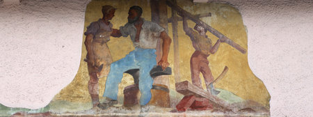 Mural paintings on houses facades in the streets of Oberammergau village, bavaria, germanyの写真素材