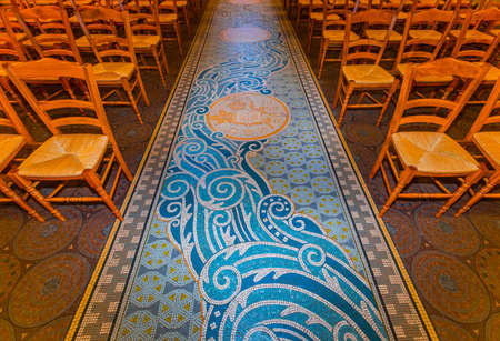 BRIARE, LOIRET, FRANCE, MAY 06, 2022: Pavement mosaic details on ground floor of Saint Etienne churchのeditorial素材