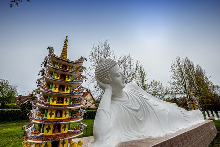 NOYANT D'ALLIER, FRANCE APRIL 11, 2023: exteriors and statues details in the garden of the vietnamese buddhist pagodaのeditorial素材