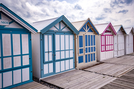 Colorful beach huts with clouds and skies in Cayeux sur mer, Somme, Normandy, Franceのeditorial素材