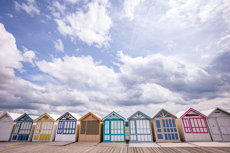 Colorful beach huts with clouds and skies in Cayeux sur mer, Somme, Normandy, Franceのeditorial素材