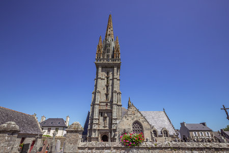GOULVEN, FINISTERE, BRITTANY, FRANCE, JUNE 30, 2025: exteriors and architectural details of the Parish Close churchの写真素材