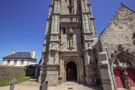 GOULVEN, FINISTERE, BRITTANY, FRANCE, JUNE 30, 2025: exteriors and architectural details of the Parish Close churchの写真素材