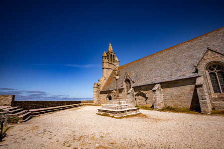 PENMARCH, FINISTERE, BRITTANY, FRANCE, JUNE 24, 2025 Exteriors and architectural details of Notre-Dame-de-la-Joie Chapelの写真素材