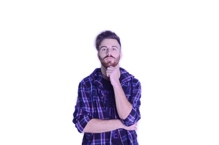 Young man worried looking at camera on isolated white background