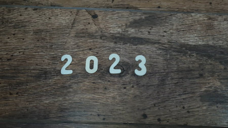 New year 2023 numbers on a wooden backgroundの写真素材