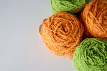 Balls of wool cotton silk yarn set on copy space white background on leftの写真素材