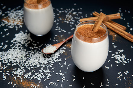 homemade Vanilla Custard with cinnamon over a white wooden table. a delicious dessert made with milk, eggs, vanilla and cinnamon. top viewの写真素材