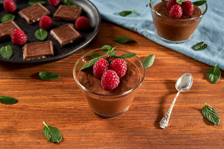 Dark Chocolate mousse homemade with raspberries and mint.の写真素材