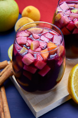 A glass of Clericot also knows as Sangria a delicious cocktail to be refreshed. Made with Red wine, apple, lime and some orange to decorate.の写真素材