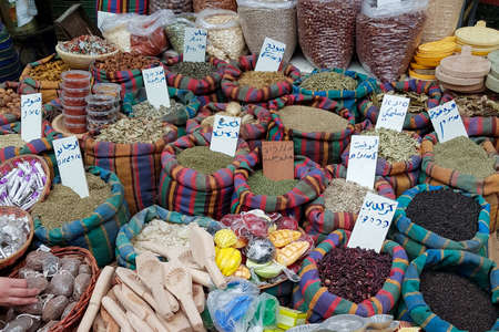 open bags of nuts with dried fruit spices on the marketの写真素材