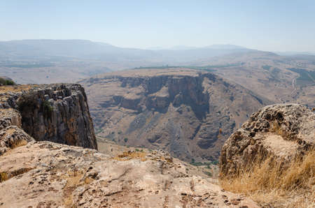 landscape in the mountains on a sunny day with a view from the mountain settlement of people and the...
