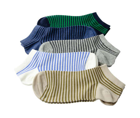 a pair of striped short socks in different colors are located on a white backgroundの写真素材