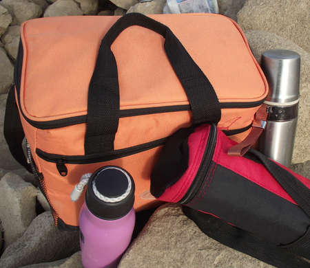 bottles   bag lie on the stones at the parking lot of touristsの写真素材