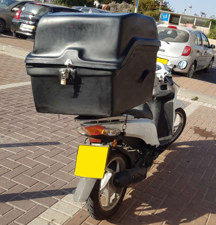 food delivery moped with attached large boxの写真素材
