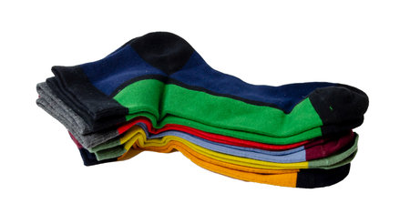 on a white background a lot of multicolored socks are laid out and isolatedの写真素材