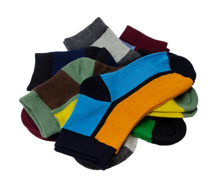 on a white background a lot of multicolored socks are laid out and isolatedの写真素材