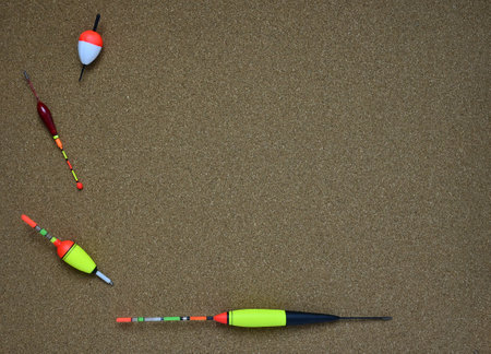 fishing floats lie on a sheet of light brown leather
