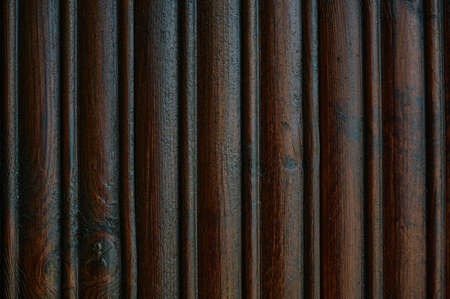 old house wall made of old boards for covering the house from the outside