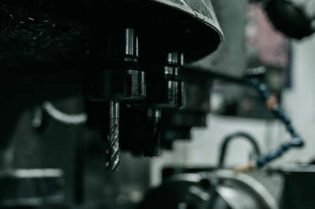 Close-up of a CNC machine at work at the factory