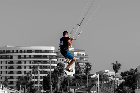 Nahariya, Israel - November 5, 2021: Galei Galil Beach. A man is kitesurfing on the sea in sunny weather close-upのeditorial素材