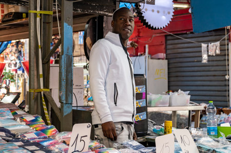 TEL AVIV, ISR - January 25, 2022: Israelis shop at the Carmel Shuk HaCarmel Market in Tel Aviv, Israel. This is a very popular market in Tel Aviv where they sell confectionery as well as fruits and vegetables.のeditorial素材