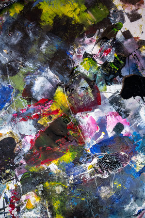 artist's palette of colorful oil paint for drawing and painting. view from above