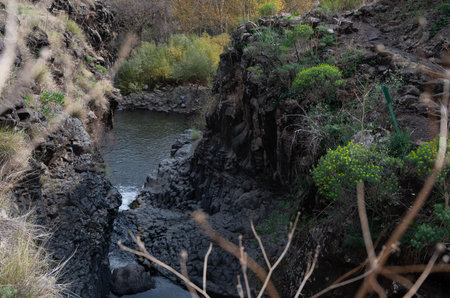 Mountain stream Meshushim. Nahal Meshushim. Rocks in the form of hexagonal basalt columns. Golan Heights. israel.の写真素材
