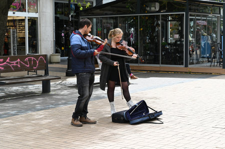Bulgaria, Sofia, April 15, 2023: people in the Vitosha Boulevard. Street musician