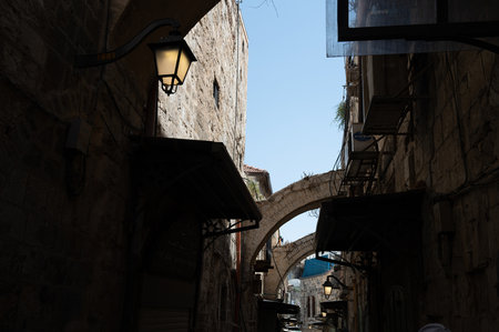A narrow street among stone houses in old Jerusalem, Israel. High quality photo