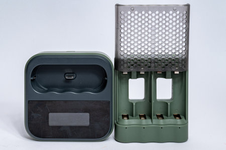 Professional charger for four AAA batteries isolated on white background. High quality photoの写真素材