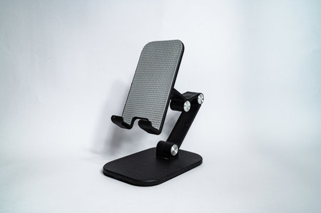 Stand for mobile mellephone for table. Isolated on a white background. High quality photo