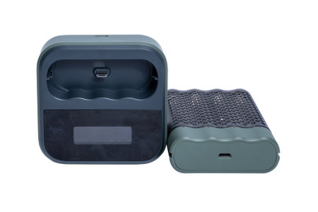 Charger for four AAA batteries isolated on white background. High quality photoの写真素材