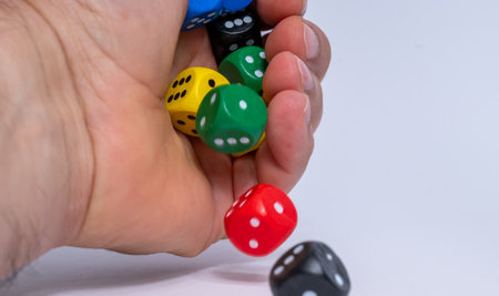 Man's hand throwing dice isolated on white background. High quality photoの写真素材
