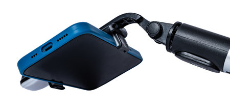 Selfie stick and smartphone isolated on white background. High quality photoの写真素材