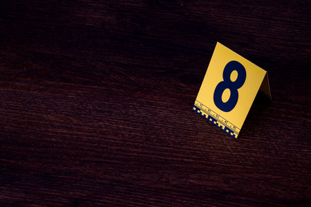 Yellow crime scene evidence marker number 8 on the floor in the room. High quality photoの写真素材
