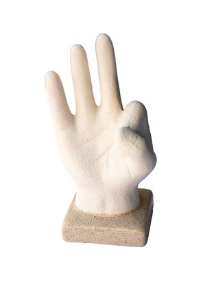 Sculpture of a hand making OK gesture, ceramic or plaster art piece on square base, symbol of approval and positivity. High quality photoの写真素材