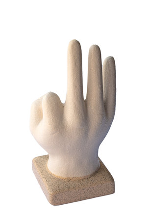Sculpture of a hand making OK gesture, ceramic or plaster art piece on square base, symbol of approval and positivity. High quality photoの写真素材