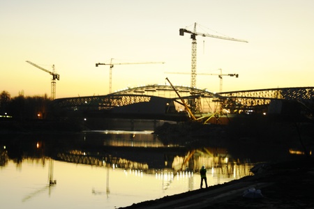 images of constructive tasks in the current works both machines and workersの写真素材