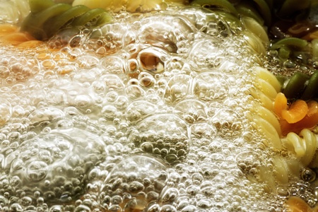 spiral pasta in boiling hot water Closeの写真素材