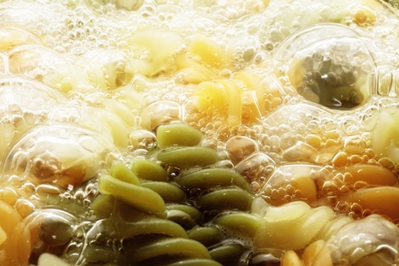 spiral pasta in boiling hot water Closeの写真素材