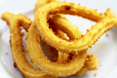 Churros gastronomic scene highlighting breakfast appetizing color and textureの写真素材