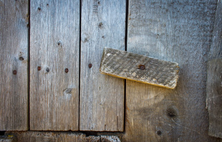 The wooden latch on the barn door in the countrysideの写真素材