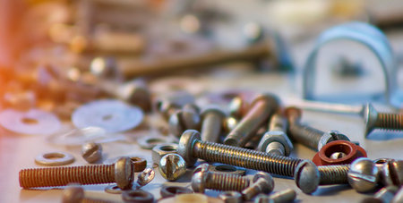 Blurred construction background with nuts and boltsの写真素材