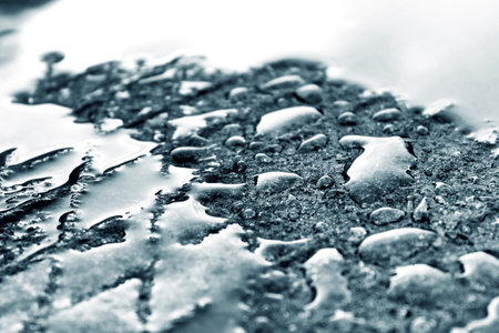 Wet metal surface. Black and white background.の写真素材