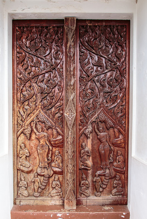 Old wood door with Thai patternの写真素材